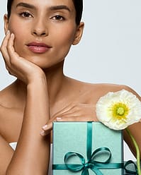 Woman with blue gift boxes