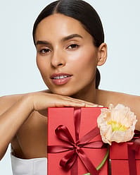 Woman with red gift boxes