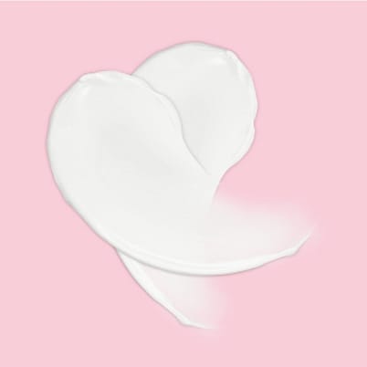 Weiße Creme auf rosa Hintergrund