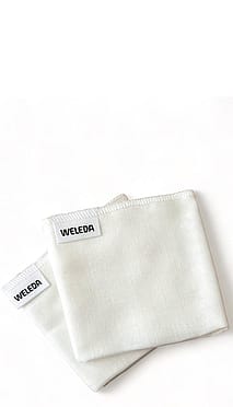two white muslin cloths folded.