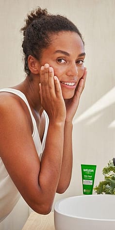 woman-washing-her-face-with-skinfood-in-background.jpg