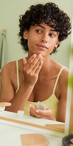 woman cleaning face