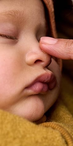 Mum touching babys nose