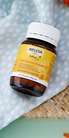 Baby Teething Powder on baby blanket.
