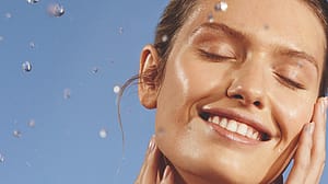 Woman cleansing her face