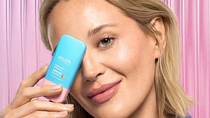 Model is holding Hyaluronic Serum in front of face