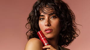 Model holding pomegranate