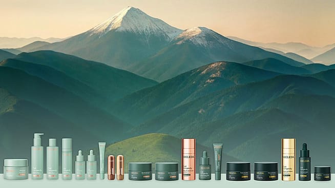 Produkte der Weleda Cell Longevity Serie vor einem Berghintergrund