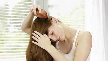 woman combing hair