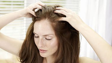 Woman touching her hair