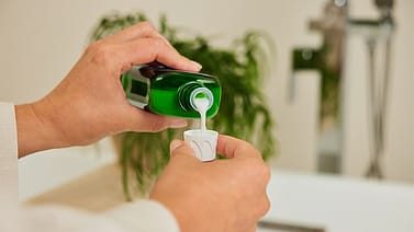 bath milk pouring into cap
