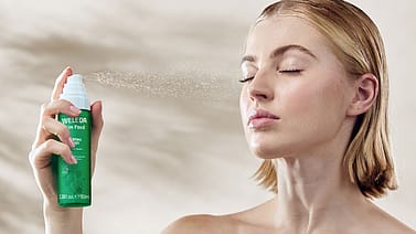 model applying Skin Food Hydrating Face Mist