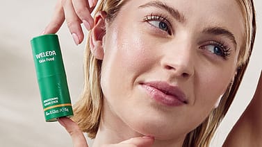 model applying Skin Food Brightening Serum Stick