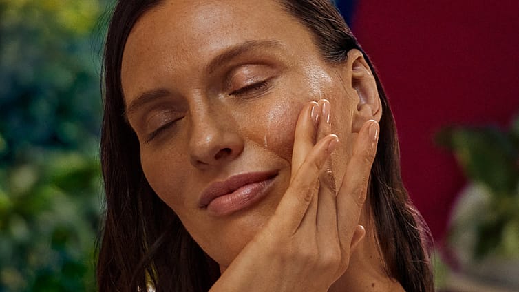 woman applying plumping night cream