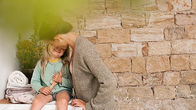 mother and girl laughing