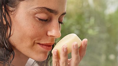 woman smelling soap