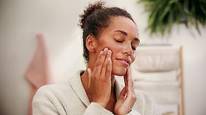 woman applying cream
