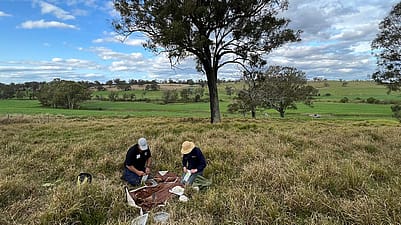 two people in grass