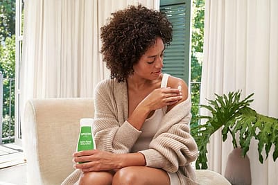 Woman using Skin Food Body Lotion