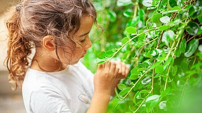Young girl with leaves