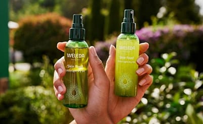 Hands holding Skin Food ultra-Light Dry Oil