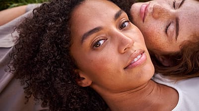 two women laying