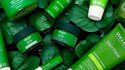 Weleda Skin Food range on a bed of green leaves