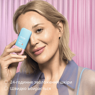 Model is holding Hyaluronic Serum in front of face