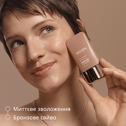 Model holds Product next to face