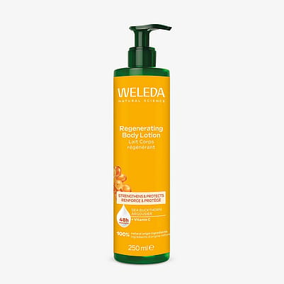 Woman with swatch of Weleda body lotion on her arm.