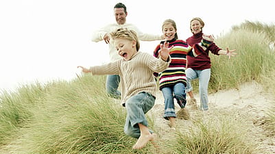 family looking at water