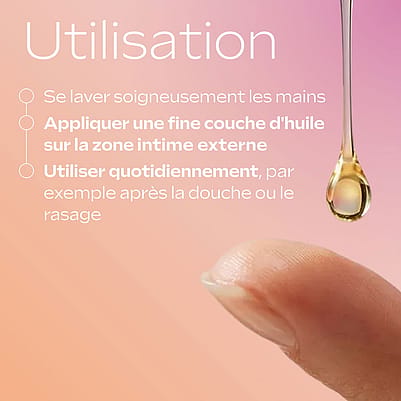 Goutte d’huile tombant sur le bout d’un doigt