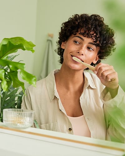 Woman brushing teeth