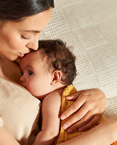 Woman looking down at baby