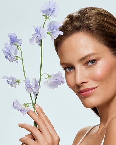 Woman holding Iris flower