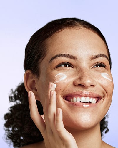 Woman using facial products