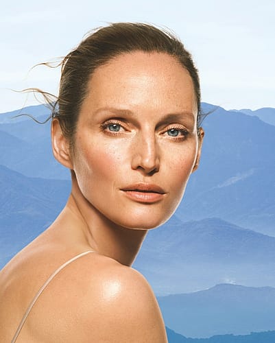 Woman in front of mountains