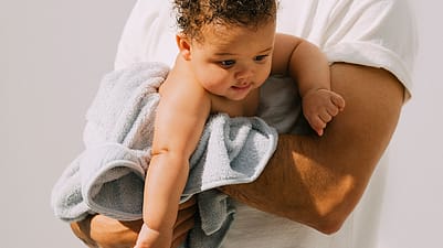 Dad playing with baby