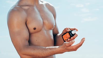 Man applying arnica