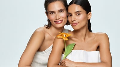 Two women and a flower