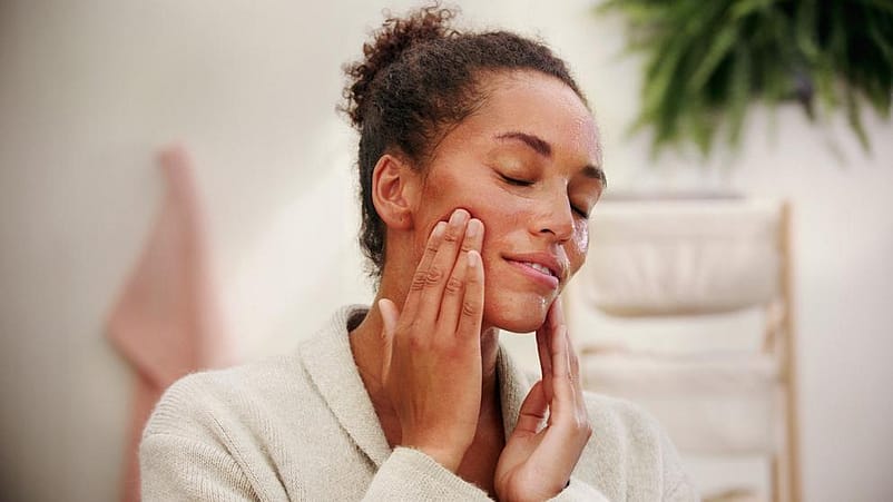 woman applying cream