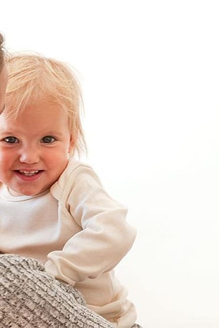 baby on mothers arm