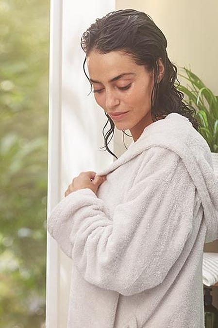 Woman in a bath robe.
