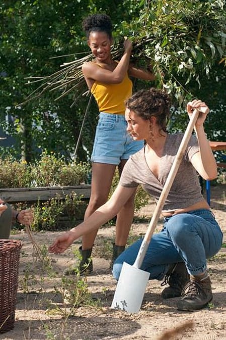 three women engaged in gardening activities