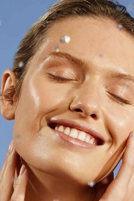 Woman smiling with eyes closed