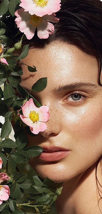 woman standing in roses