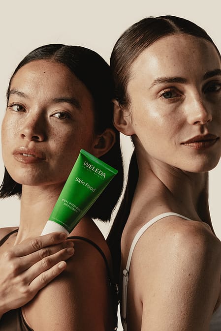 Two models holding Skin Food