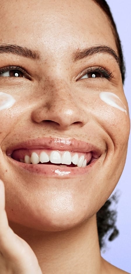 Woman applying face care
