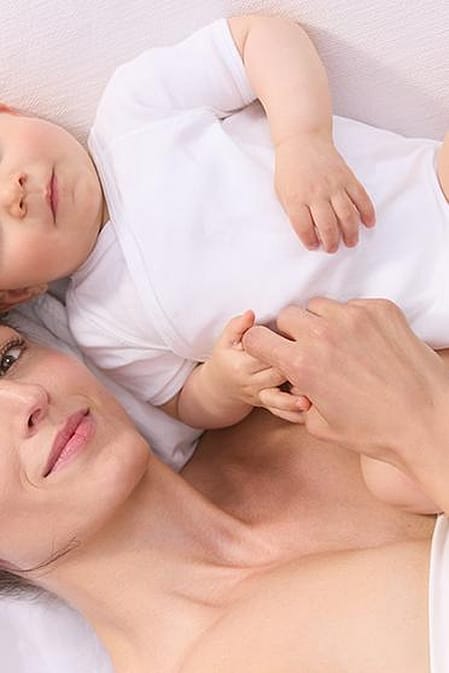 mother and baby lying down