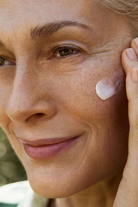 woman applying cream